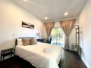 a bedroom with a bed and a window at Quiet King Bedroom near DT Toronto in Toronto +19 photos