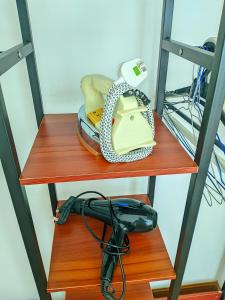 two wooden shelves with a telephone on them at Sky Suite KLCC Apartment klcc in Gua Sai