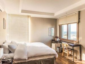 Ένα ή περισσότερα κρεβάτια σε δωμάτιο στο Check Inn Hotel +178 φωτογραφίες