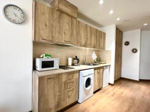 Η κουζίνα ή μικρή κουζίνα στο Apricot inn apartments