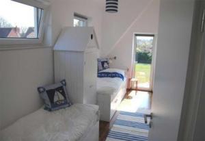 Ένα ή περισσότερα κρεβάτια σε δωμάτιο στο Haus Haltermann +2 φωτογραφίες