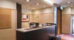 an office with a desk with a computer on it at Hotel Sealuck Pal Yaizu in Hanazawa