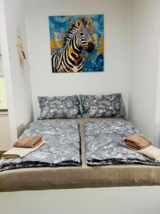 Ένα ή περισσότερα κρεβάτια σε δωμάτιο στο Studio u ZOO