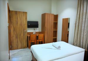 Voodi või voodid majutusasutuse KRUSHNA Boarding And Lodging toas