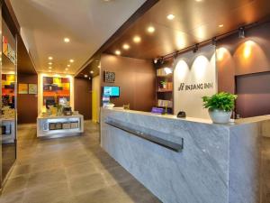 a lobby of a restaurant with a counter at Jinjiang Inn Style Xiangshan Bus Station in Xiangshan
