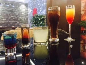 four different types of drinks on a table at Zmax Changzhi Bayi Square in Changzhi