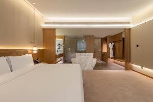 Ένα ή περισσότερα κρεβάτια σε δωμάτιο στο Wyndham Garden Shanghai Songjiang +55 φωτογραφίες