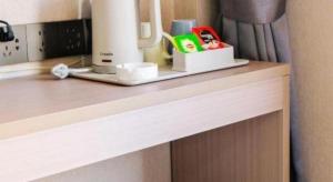 a counter top with a coffee maker on it at City 118 Hotel Aodele in Songguantun