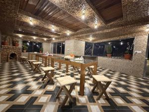 a dining room with a table and chairs in a room at Kashmir Beautiful Villa in Srinagar