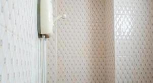a white tiled wall in a bathroom with a shower at Orchid Residence At Amata in Ban Yan Su +115 photos