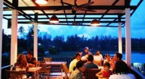 a group of people sitting at tables in a restaurant at Amin Resort in Ban Thalat Choeng Thale +82 photos