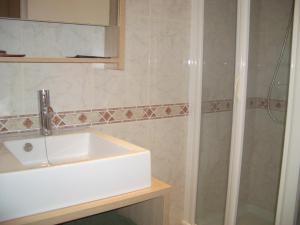 a bathroom with a sink and a shower at Sitges Beach Panorama in Sitges +38 photos