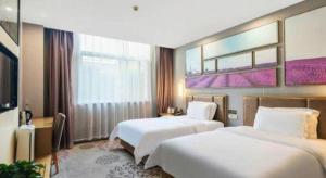 Ένα ή περισσότερα κρεβάτια σε δωμάτιο στο Lavande Hotel Xi'an Longshouyuan Wenjing Road +109 φωτογραφίες