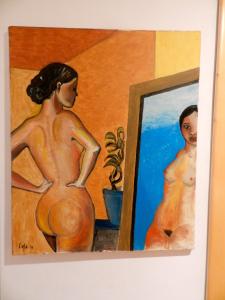 ナポリにあるModern Flat Cavourの鏡の前の女性画