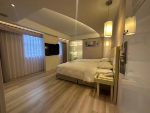 Postel nebo postele na pokoji v ubytování 台北馥華商旅 松江館 + 68 fotografií