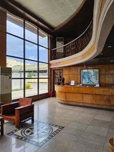 a lobby of a building with a large window at Ciello Accommodation 3 in Nabalean