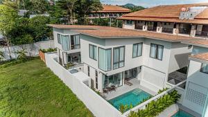 an aerial view of a house with a swimming pool at Modern 3 Bed Pool Villa Chaweng -Whispering Palm Villa A in Bang Rak Beach