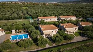 an aerial view of a house with a swimming pool at Asfendamos in Kakovatos