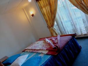 Ένα ή περισσότερα κρεβάτια σε δωμάτιο στο Ragith Villa