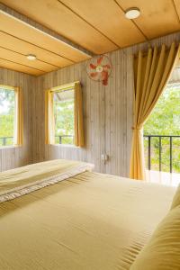 Ένα ή περισσότερα κρεβάτια σε δωμάτιο στο Nhà Của Thùy