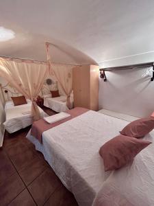 a bedroom with two beds and a tent at Casa Triana in Cuevas del Campo +27 photos