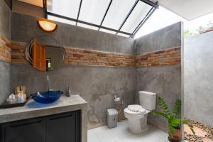 a bathroom with a sink and a toilet and a mirror at Baan Piengfah Holiday Home Ao Nang in Ao Nang Beach +28 photos