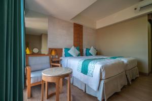 Ένα ή περισσότερα κρεβάτια σε δωμάτιο στο Bedrock Hotel Kuta +18 φωτογραφίες