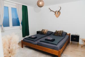 a bedroom with a bed with two pillows on it at Voll ausgestattete 3 Zimmer Wohnung mit 2 Schlafzimmer in Villingen-Schwenningen