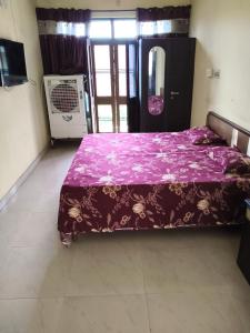 Ένα ή περισσότερα κρεβάτια σε δωμάτιο στο Nitin pg