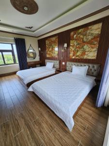 Postel nebo postele na pokoji v ubytování Hotel Kim Long Hồ Tràm + 1 fotografie