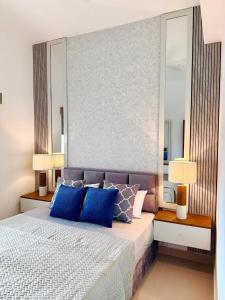 Ένα ή περισσότερα κρεβάτια σε δωμάτιο στο The Golfside Luxe