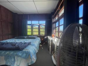 Postel nebo postele na pokoji v ubytování Stay with sumo homestay