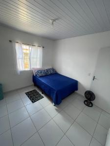 Ένα ή περισσότερα κρεβάτια σε δωμάτιο στο Casa aconchegante