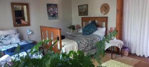 Ένα ή περισσότερα κρεβάτια σε δωμάτιο στο Good News Guest Units