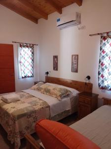 Ένα ή περισσότερα κρεβάτια σε δωμάτιο στο La Nueva