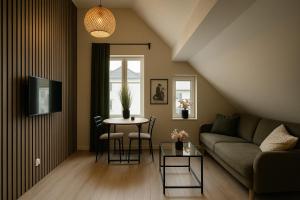 a living room with a couch and a table at A Place To Stay Stavanger, apt 3 in Stavanger