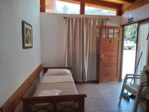 Ένα ή περισσότερα κρεβάτια σε δωμάτιο στο La Nueva