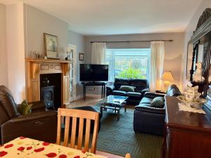 a living room with a couch and a table at 3 bedroom home close to Athenry in Galway in Athenry