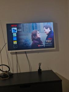 a flat screen tv hanging on a wall at Lägenhet i Lindesberg 50kvm in Lindesberg