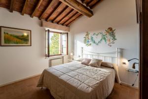 En eller flere senge i et værelse på The Nest Il Giglio Rapolano Terme