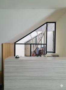 an empty room with a large window in a building at Behomy Maxley Lippo Karawaci in Tangerang +14 photos