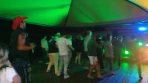 a group of people dancing in a green party at ZEcamping 4 étoiles familial animaux acceptés familial piscine couverte in Aureilhan