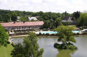 an aerial view of a resort with a swimming pool at ZEcamping 4 étoiles familial avec étang de pêche et piscine chauffée in La Haye-du-Puits