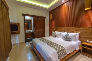 Ένα ή περισσότερα κρεβάτια σε δωμάτιο στο Nalin Bali Villas