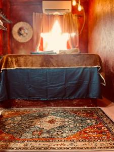 a room with a table with a rug and a fireplace at Alter Space Workspace and CoLiving in General Luna +6 photos