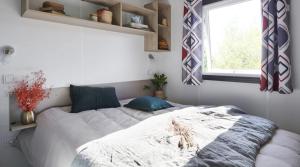 Postel nebo postele na pokoji v ubytování Camping 3 étoiles - ccaffib