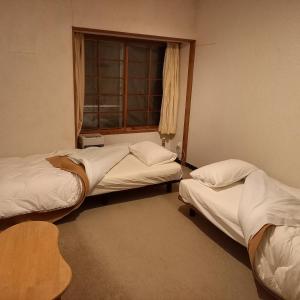 Ένα ή περισσότερα κρεβάτια σε δωμάτιο στο 横磐梯リロード