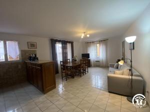 a living room with a couch and a table at Grenache rdc in Fosse