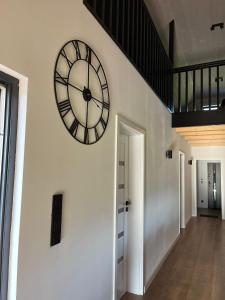 a large clock on a wall in a hallway at Villa Panorama in Żywiec