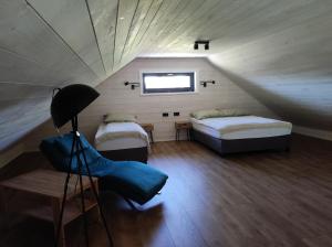 En eller flere senge i et værelse på Villa Panorama